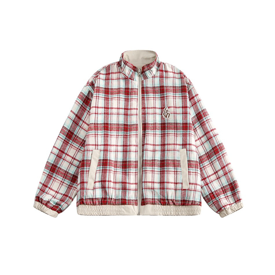 Front view of a red, cream, and pale blue plaid zip jacket with a stand collar, cream pockets, and elastic trim.