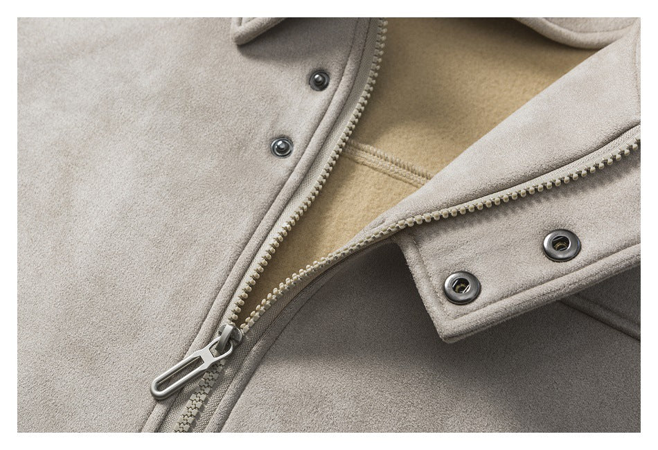 Close-up of the taupe jacket's zipper, metal snap fasteners, and beige inner lining.