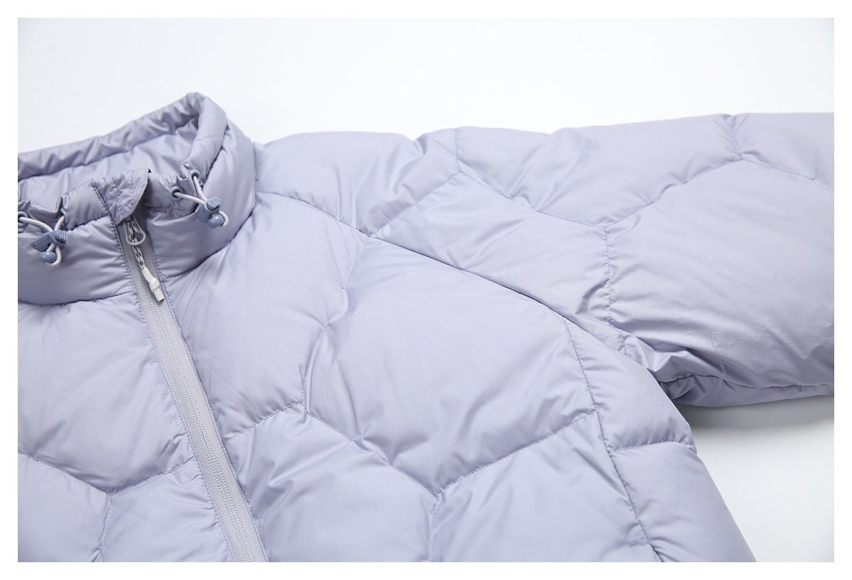 Close-up of a pale lavender quilted jacket showing its high collar, drawcord toggles, front zipper, and sleeve.
