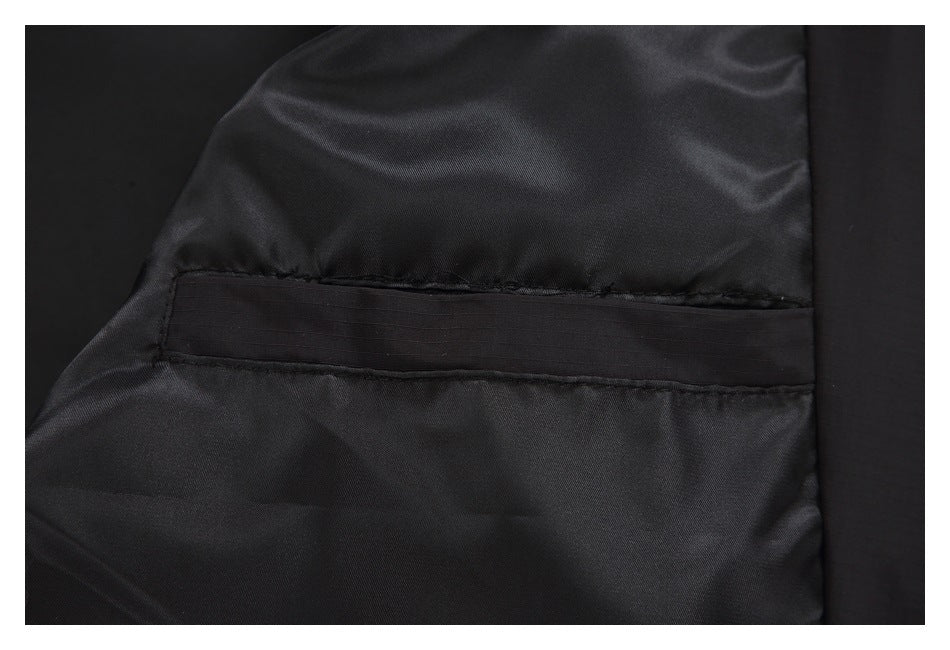 Close-up of a horizontal seam and narrow fabric strip on the jacket’s black lining.