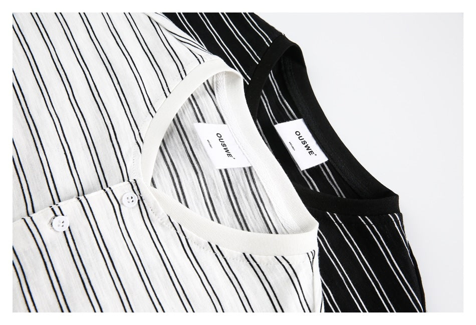 Close-up of white and black striped shirts showing V-neck trim, labels and button plackets.