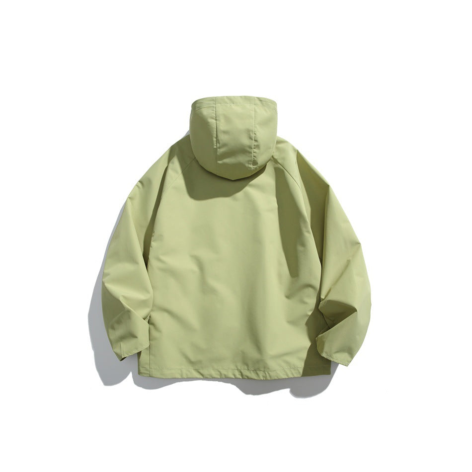 Back view of a pale yellow-green hooded jacket laid flat against a white background.