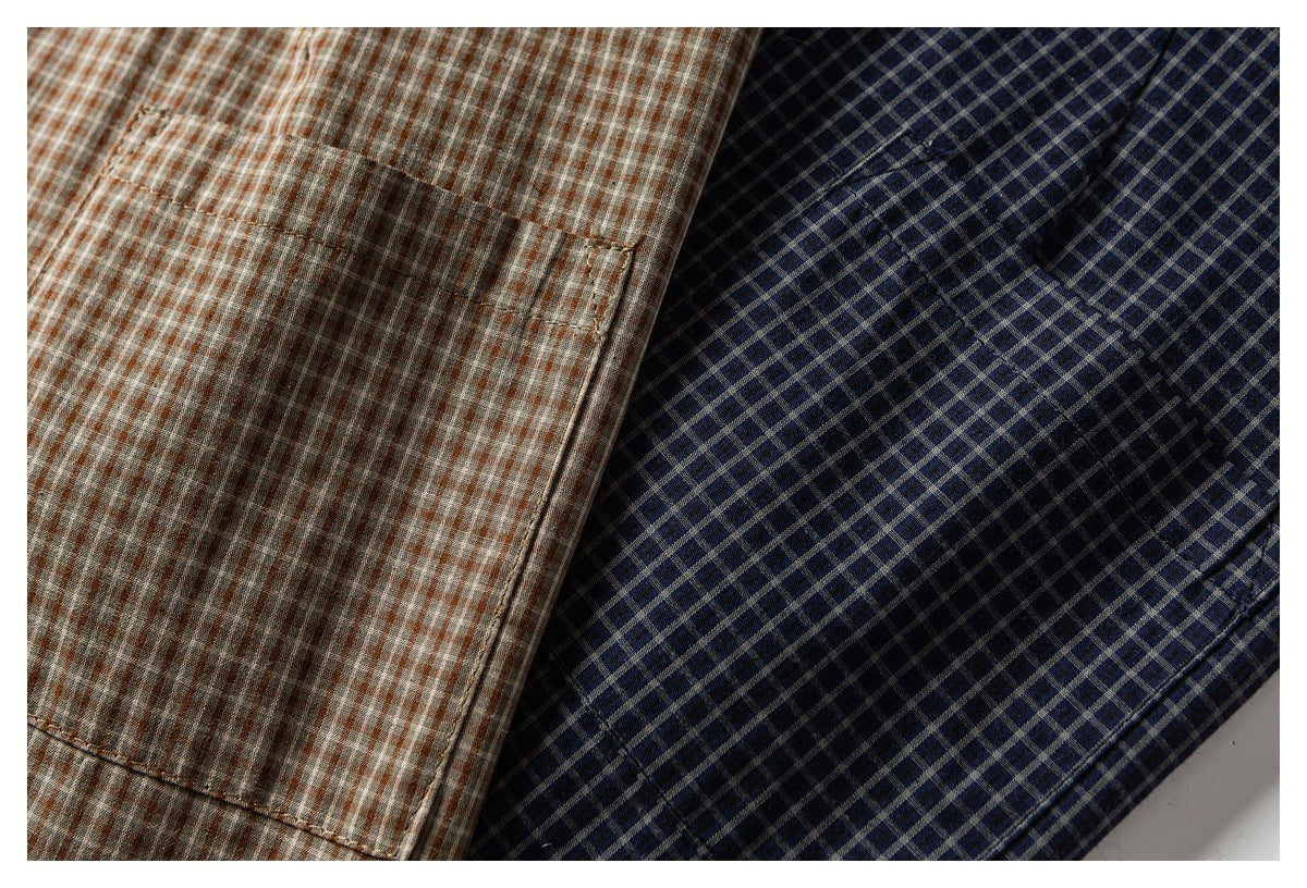 Close-up of two checked shirt colorways: rust and gray on the left, navy and gray on the right.
