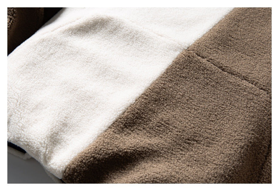 Close-up showing cream and brown fuzzy fabric panels and their seam.