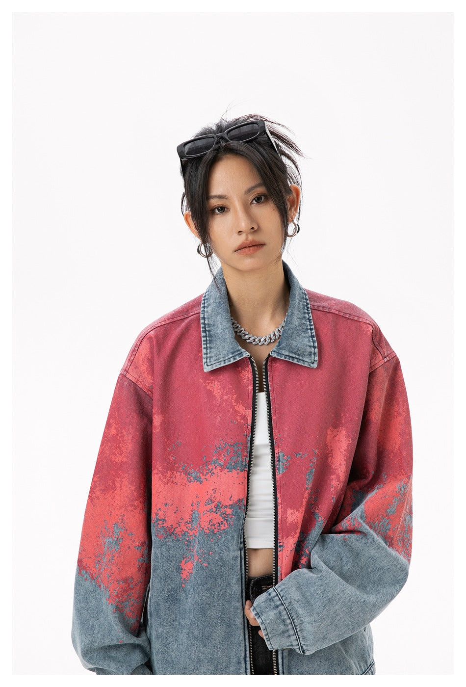 Model wearing a red and blue distressed denim zip jacket, shown from the front with the full collar and sleeves visible.