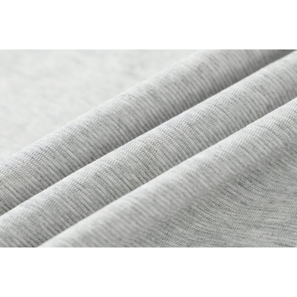 Macro view of the light gray jacket fabric, showing its fine heathered knit texture.