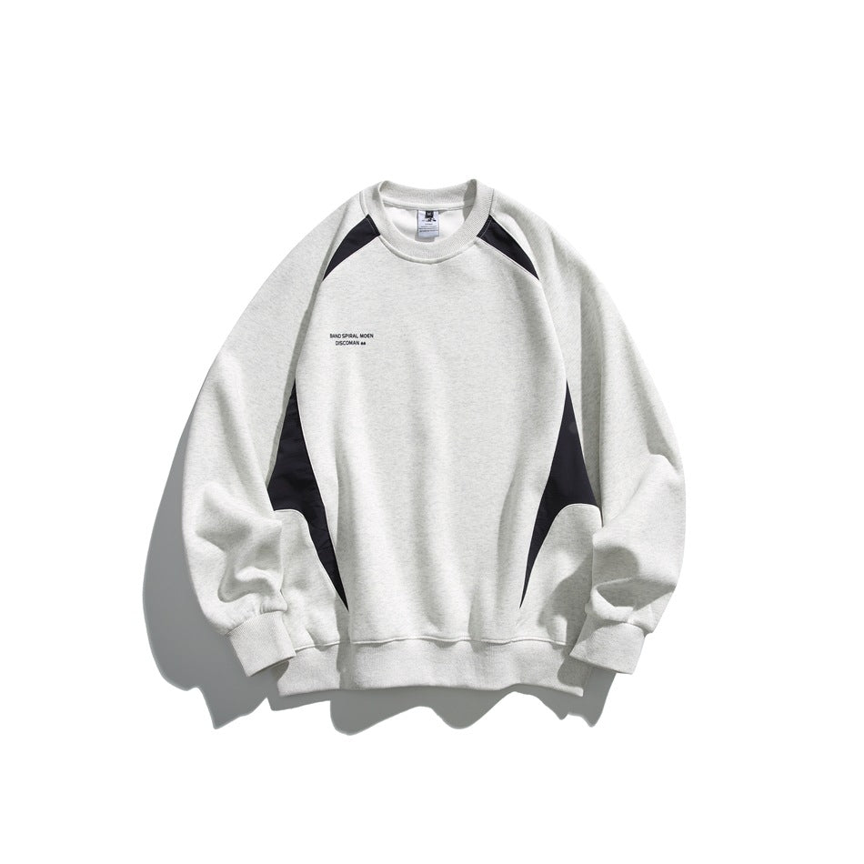 Front view of a light gray raglan crewneck sweatshirt with black shoulder and side panels and small chest lettering.