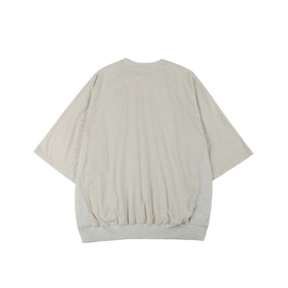 Light heathered gray oversized raglan tee with side panels and ribbed hem, flat lay back view