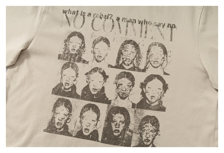 Close-up of a beige T-shirt graphic with distressed lettering and a grid of portrait illustrations.