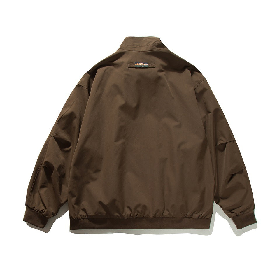 Back view of a brown stand-collar jacket with elastic cuffs and hem and a small upper-back patch.