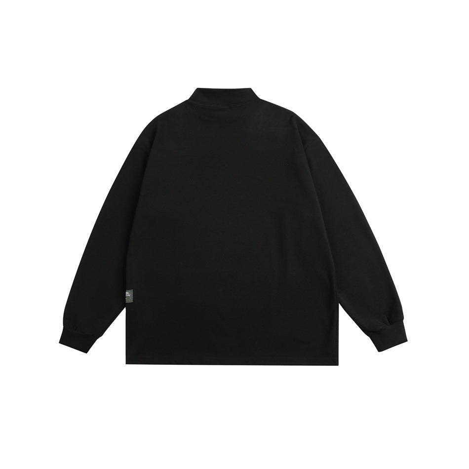 Black mock-neck long-sleeve top flat lay, back view, with plain back and small side label