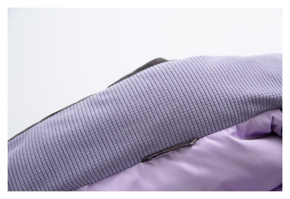 Close-up of ribbed gray-lavender trim above smooth lavender jacket lining.