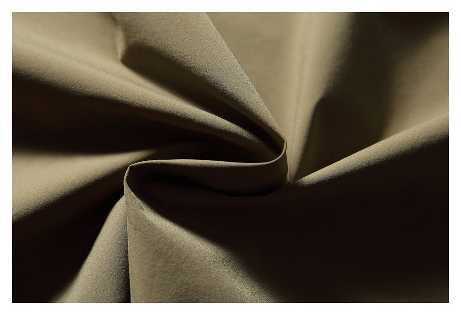 Close-up showing the softly draped olive-khaki shirt fabric and its texture.