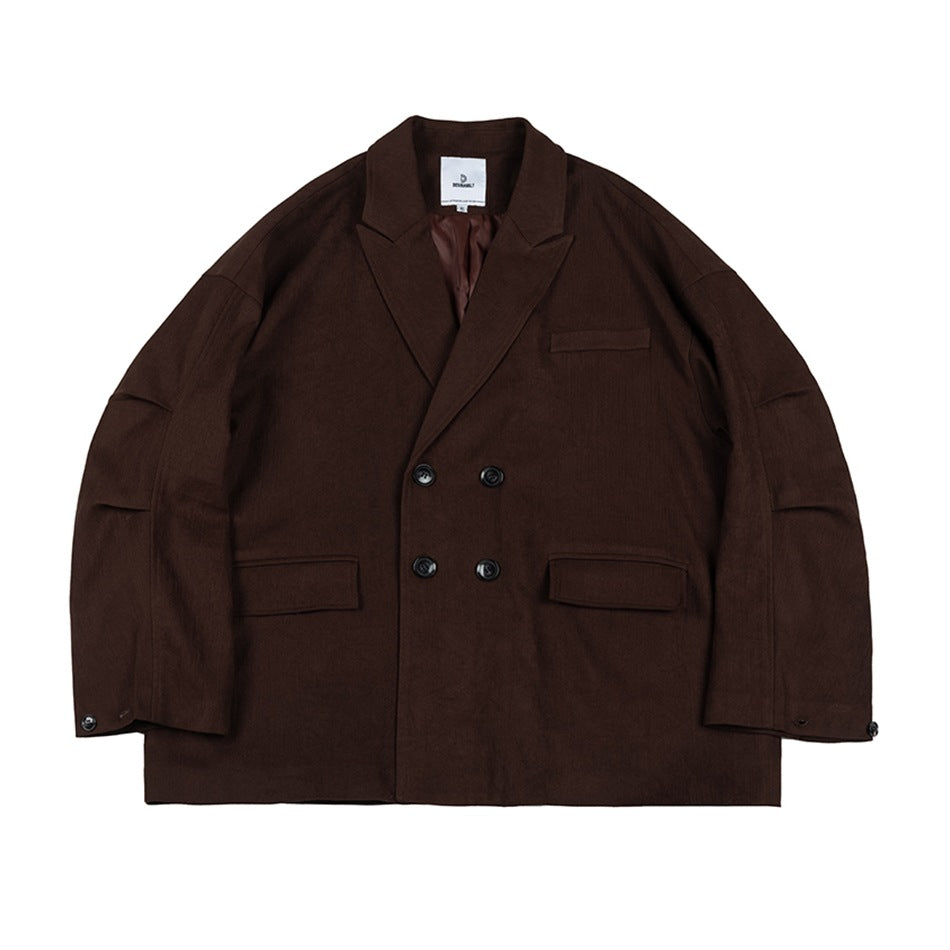 Dark brown double-breasted blazer-style jacket flat lay with peak lapels, four buttons and flap pockets