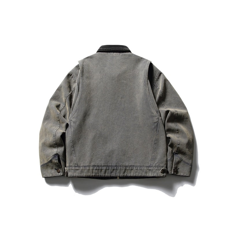 Back view of washed olive-gray work jacket with yoke seams, waistband side tabs and button cuffs