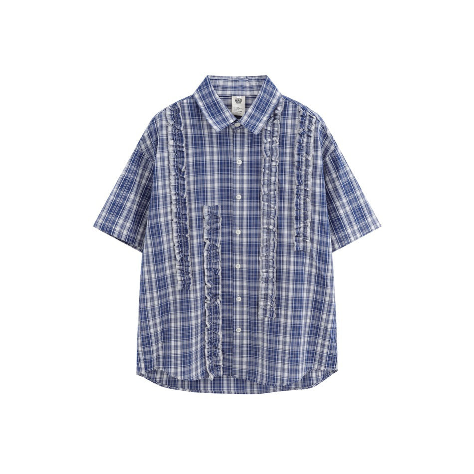 Deep blue plaid short-sleeve button-up shirt with vertical ruffle trim strips on the front, flat lay