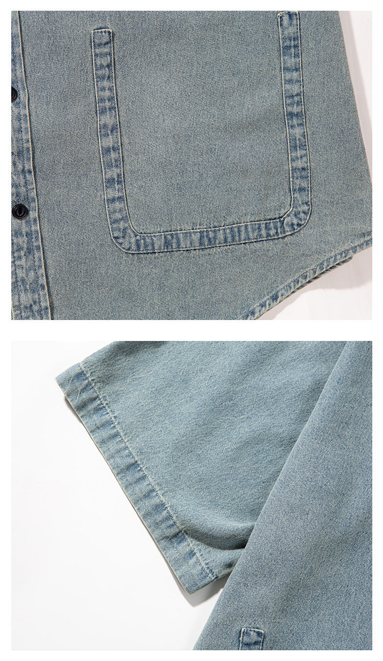 Close-up of a light blue denim shirt showing a large patch pocket, dark buttons, seams, and a sleeve hem.