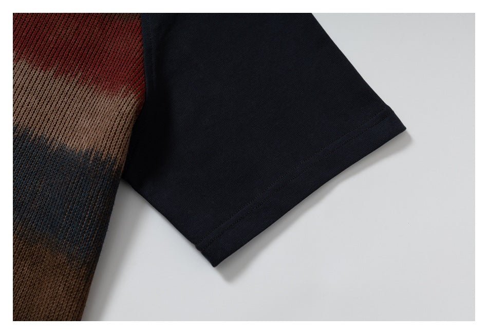 Close-up of a navy sleeve hem beside brown, red, and blue textured knit fabric.