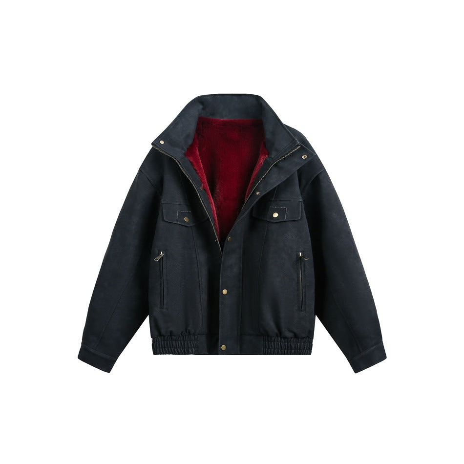 Front view of a black jacket with an open front, burgundy lining, flap chest pockets, vertical zip pockets and a gathered