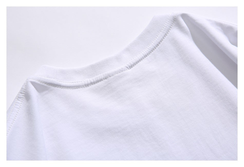Close-up of a white shirt's crew neckline, shoulder seam, and stitching.