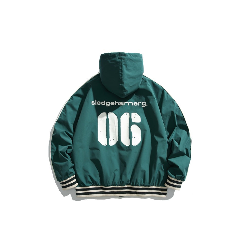 Back view of a teal hooded jacket with cream piping and striped ribbed cuffs and hem, printed with white graphics.