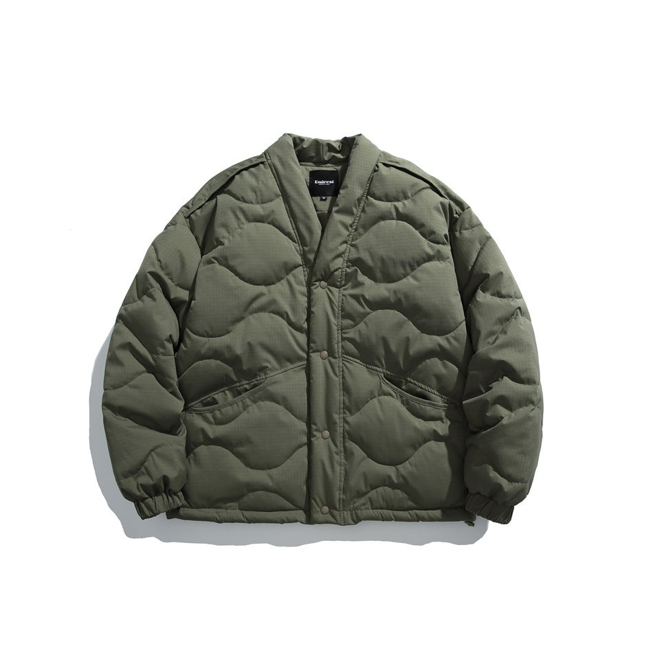 Front view of an olive green quilted jacket with a V-neck, snap buttons, and two pockets.