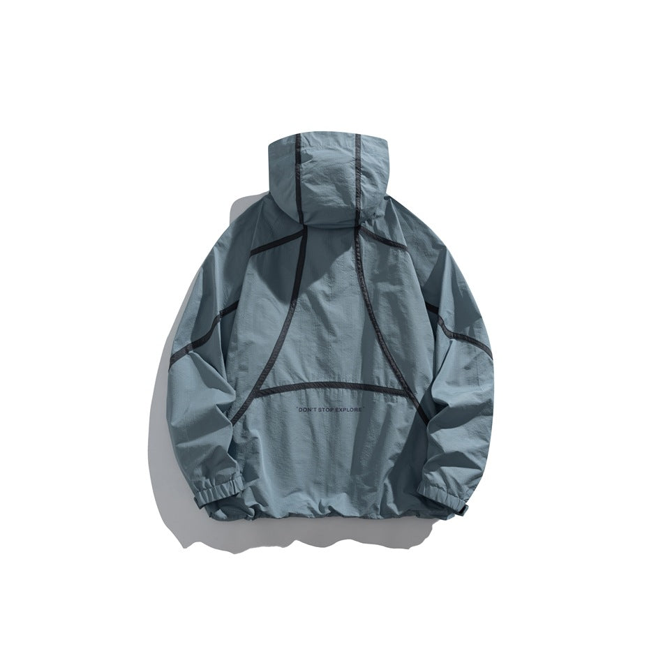 Blue-gray hooded pullover jacket shown from the back, with dark seam detailing and elastic cuffs.