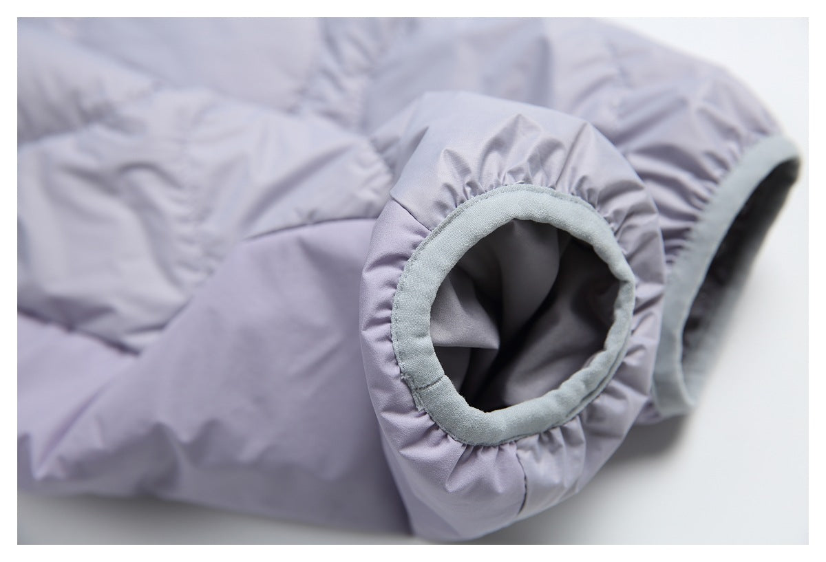 Close-up of a pale lavender-gray jacket sleeve cuff with gathered fabric and gray binding.