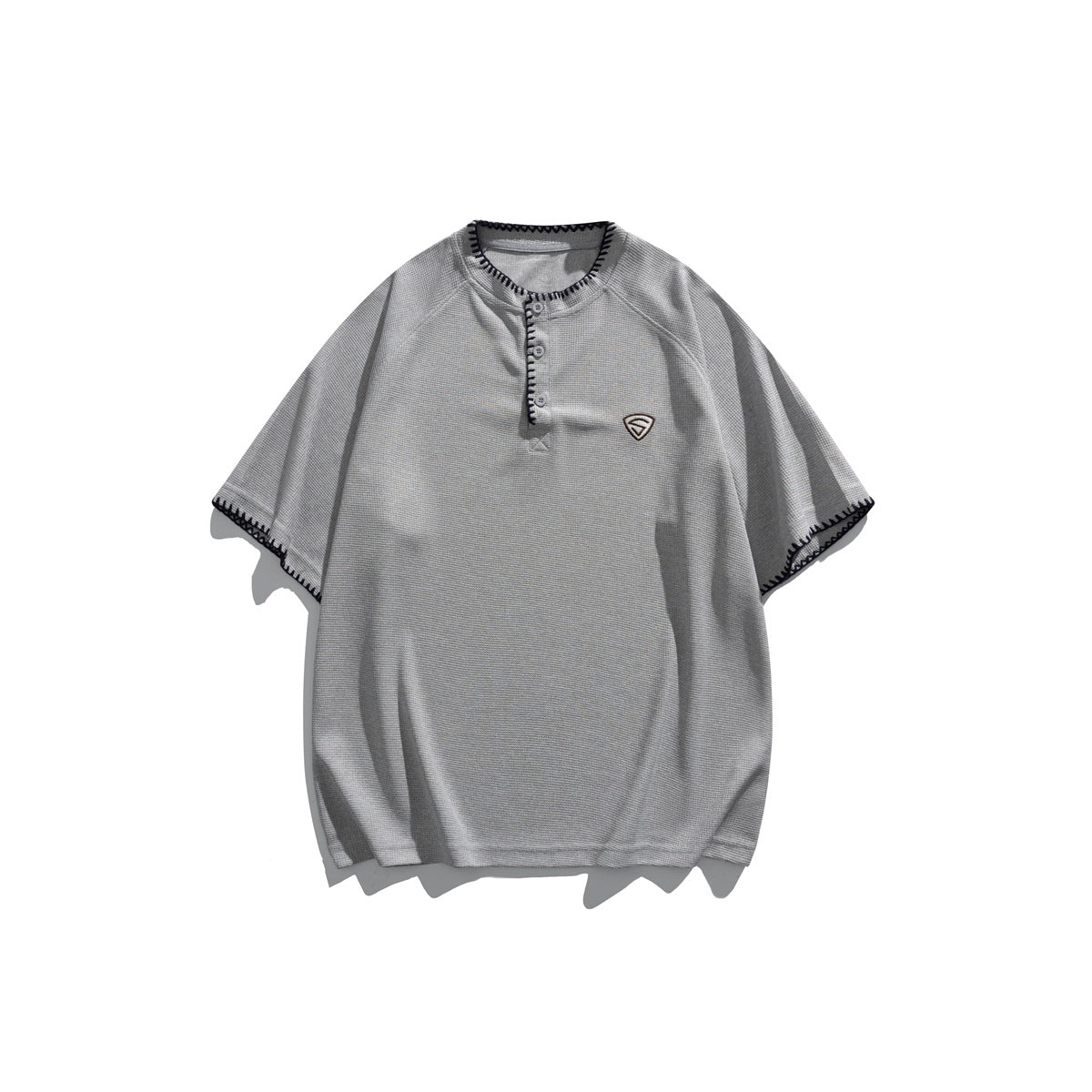 Gray short-sleeve Henley T-shirt with dark whipstitch trim and a small chest emblem, flat lay front view