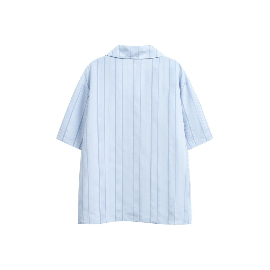 Back view of a pale blue short-sleeve collared shirt with vertical stripes.