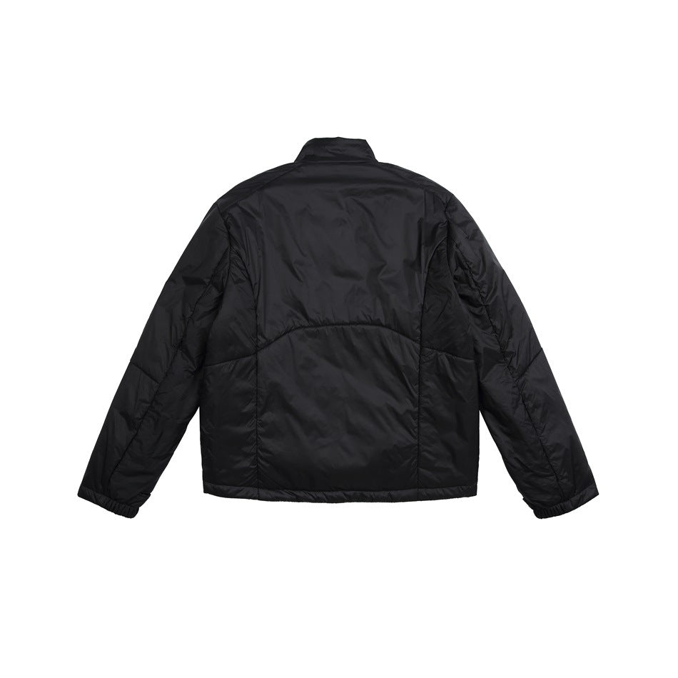 Rear view of a black jacket with a stand collar, panel seams, and elastic cuffs.