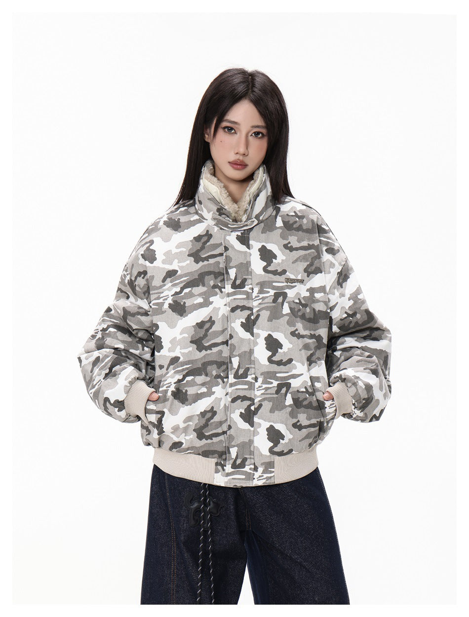 Model wearing an oversized gray-and-white camouflage jacket with a high fleece-lined collar and ribbed cuffs and hem.