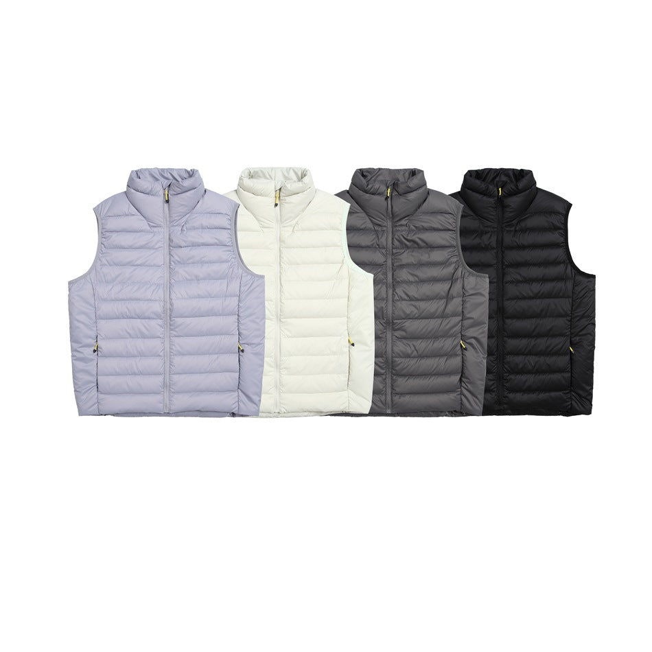 Four front-facing quilted zip vests shown in pale lavender, ivory, charcoal gray, and black.