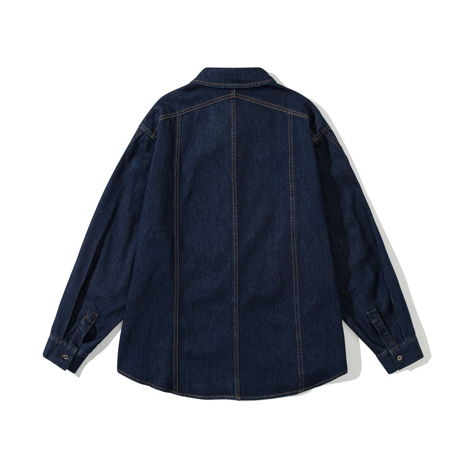Back view of dark blue denim shirt jacket flat lay with yoke seam, vertical panel seams and buttoned cuffs