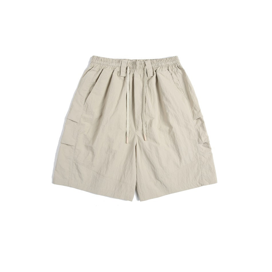Khaki knee-length shorts with elastic drawstring waist and side cargo pockets, flat lay front view