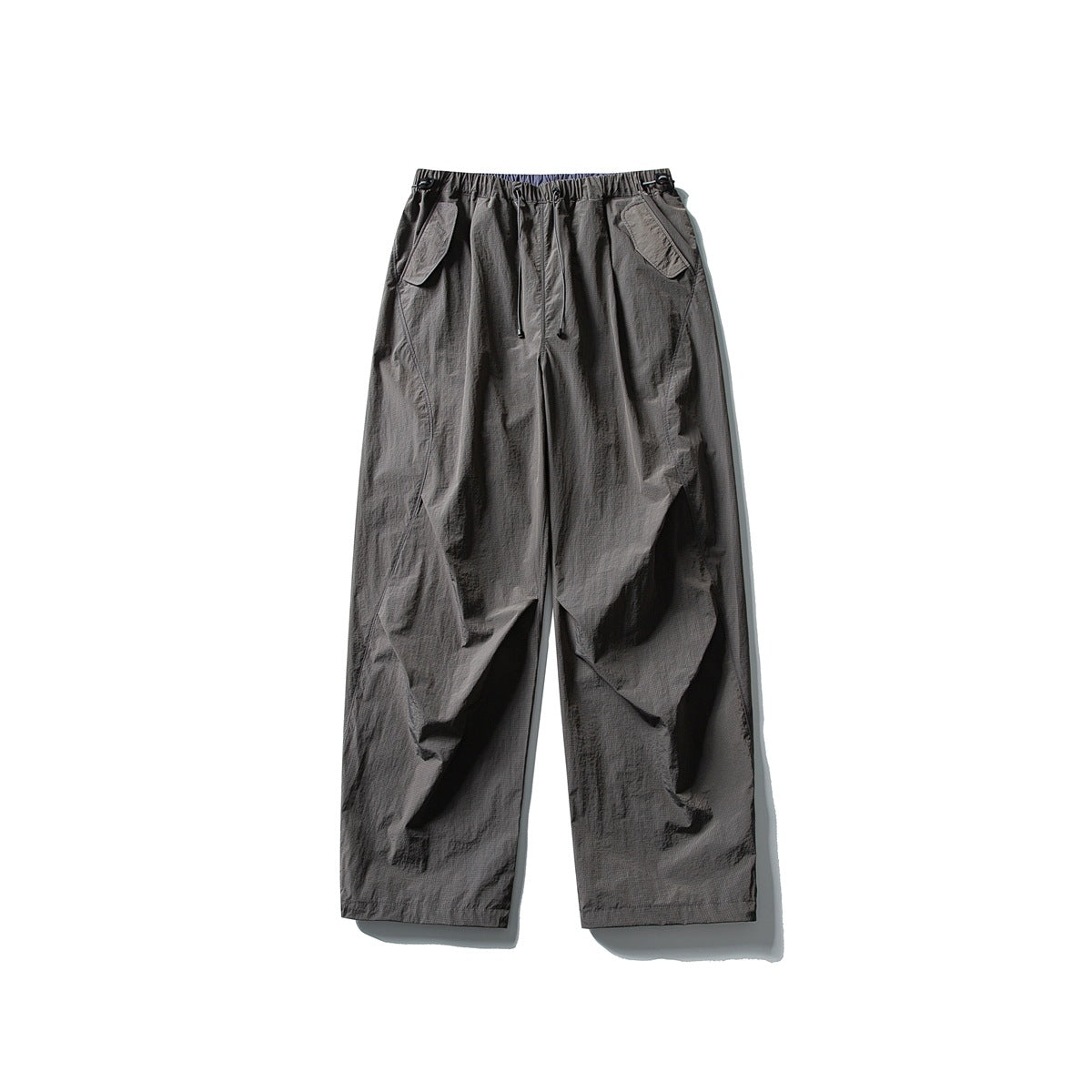 Volcanic gray wide-leg pants with drawstring waist and flap pockets, flat lay front view