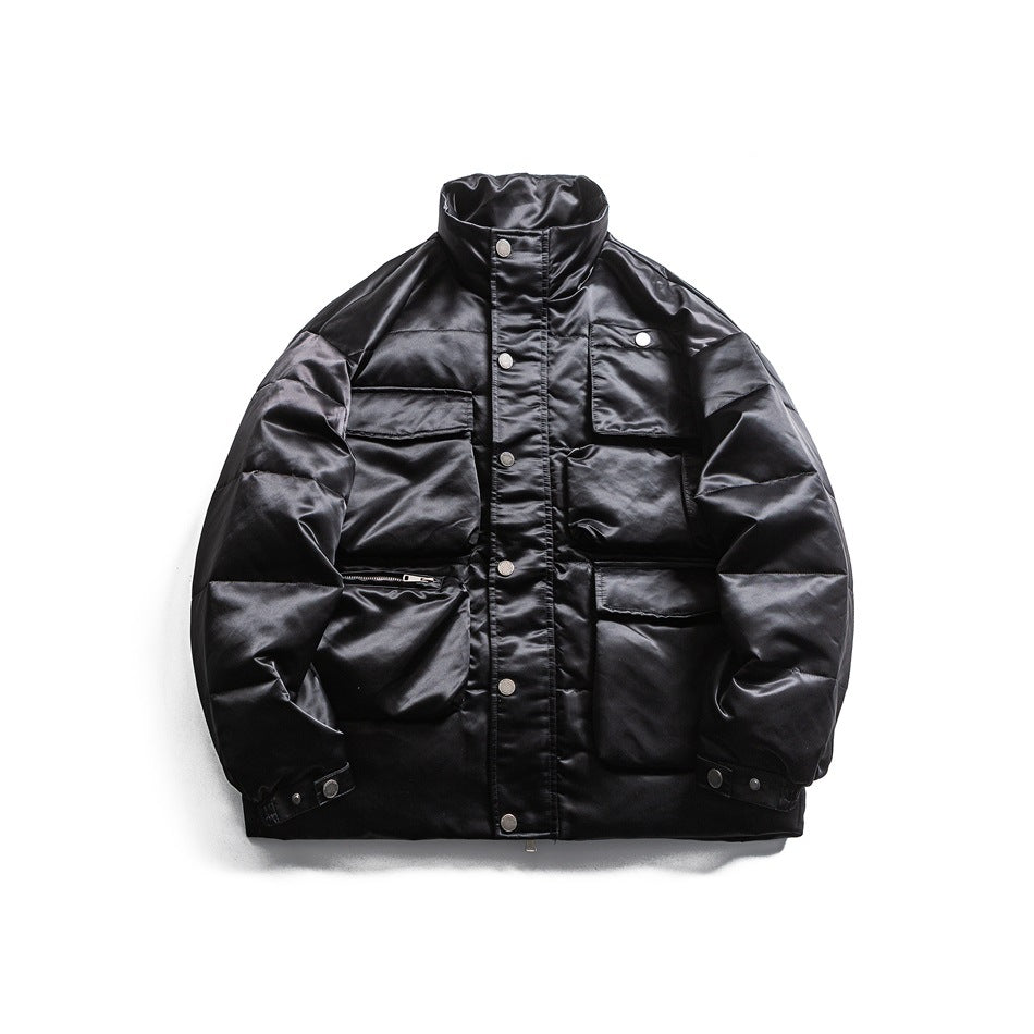 Black quilted stand-collar puffer jacket with snap front and multiple flap pockets, flat lay front view