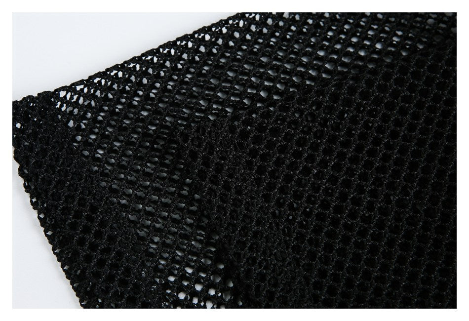 Close-up of black mesh showing open-knit and denser textured sections.