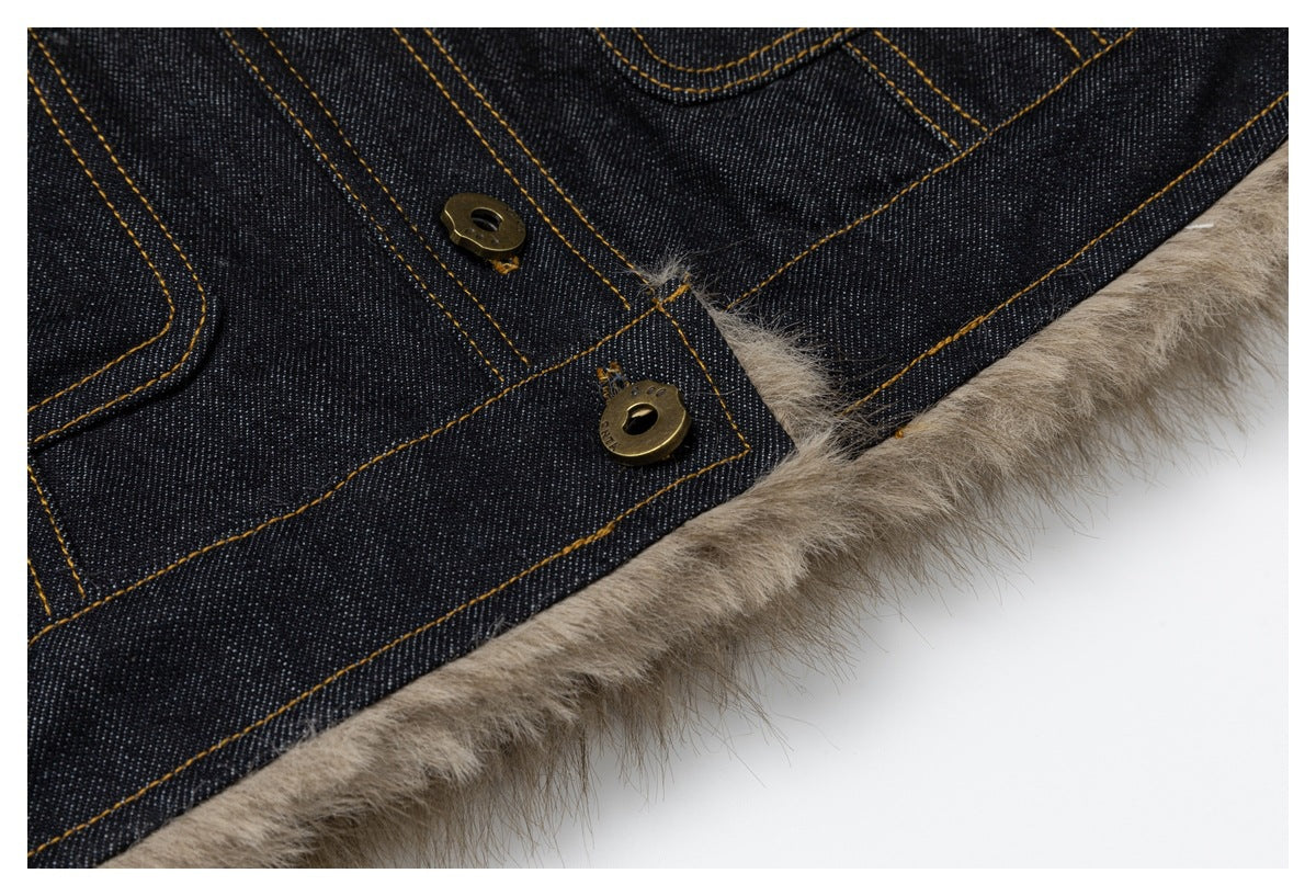 Close-up of brass buttons and taupe fluffy lining along the edge of dark denim.