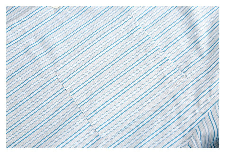 Close-up of the chest pocket on a blue-and-white striped shirt.