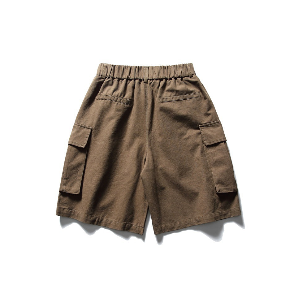 Back view of dark brown cargo shorts with a gathered waistband, two welt pockets and side cargo pockets.