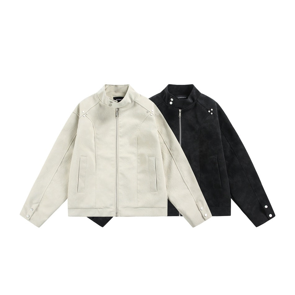 Ivory and black stand-collar jackets shown from the front, with zippers, snap details and pockets.