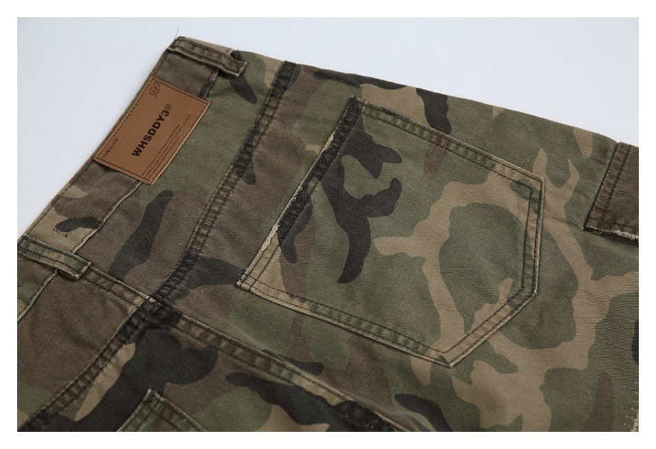 Close-up of the back pocket and waistband of camouflage pants, including a brown label.