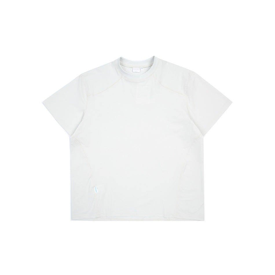 Off-white short-sleeve crew-neck T-shirt flat lay with raglan-style shoulder seams and curved side seams