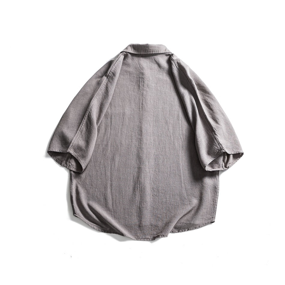 Gray short-sleeve shirt, flat lay back view with collar and plain back panel