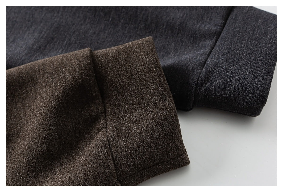 Close-up comparing brown and charcoal coat cuffs and sleeve fabric.