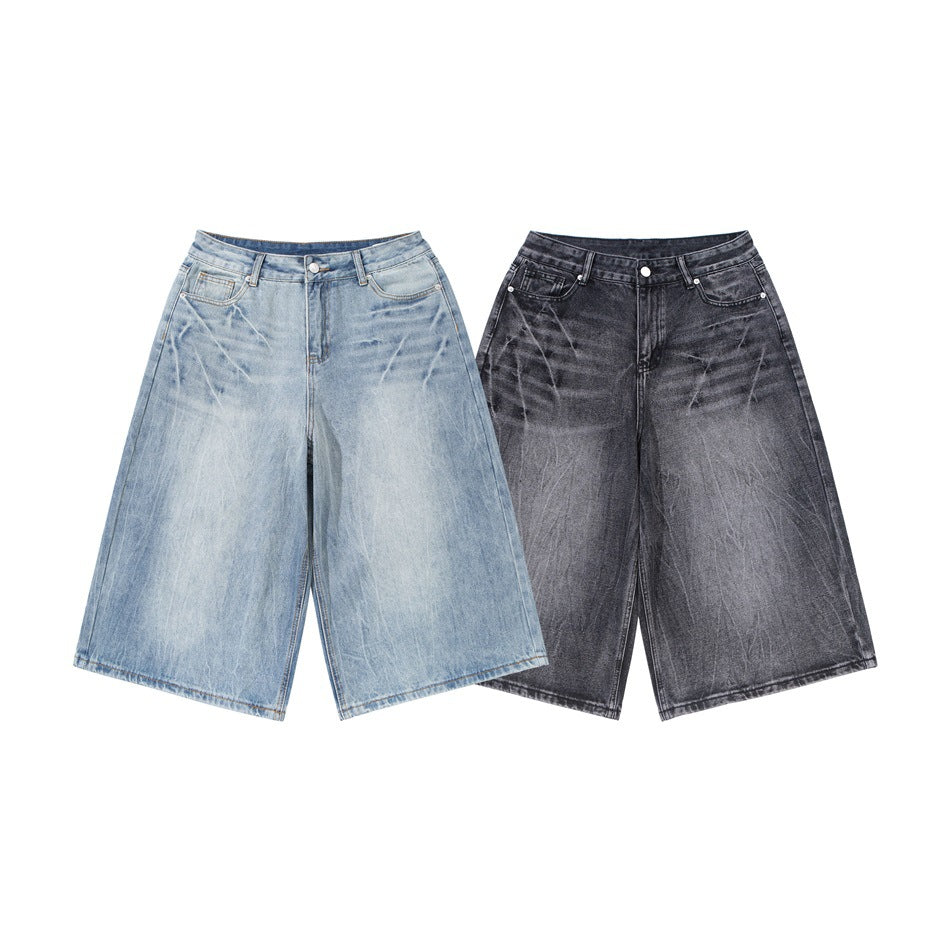 Front view of wide-leg denim shorts in light blue and dark charcoal washes, shown side by side.