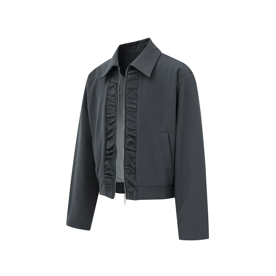 Charcoal cropped jacket shown at an angle, with a pointed collar, front zipper, gathered trim, and welt pockets.