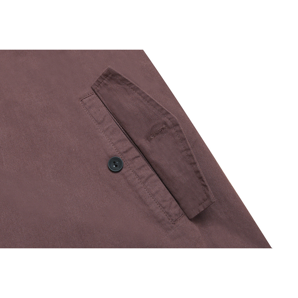 Close-up of a mauve-brown shirt's buttoned chest pocket and stitching on a white background.