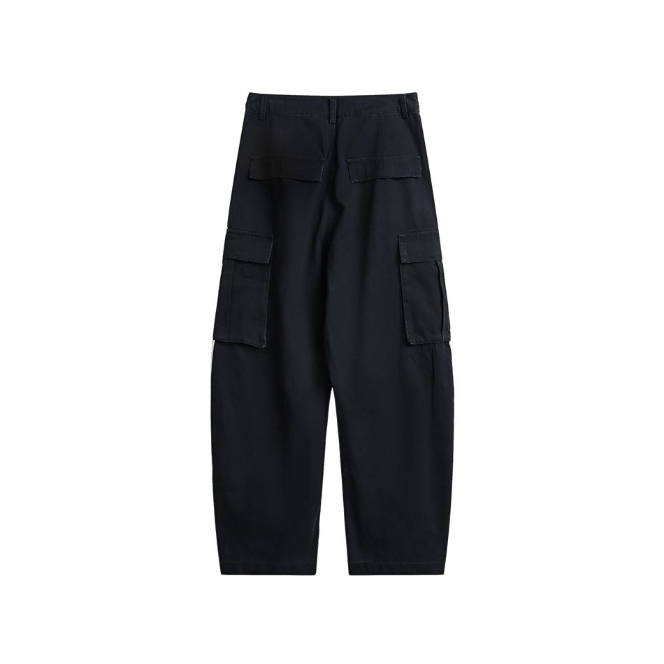 Rear view of black cargo pants with two flap back pockets and large flap pockets on the thighs.